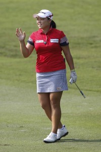 Ha Na Jang of South Korea gestures after hitting a shot on the second hole during the second round of the LPGA Malaysia golf tournament at Kuala Lumpur Golf and Country Club in Kuala Lumpur, Malaysia, Friday, Oct. 9, 2015.(AP Photo/Joshua Paul)