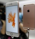 People look over the new Apple iPhone 6s models during a product display following an Apple event in San Francisco. Photography gets even better with Apple's new iPhones, making them worth getting for $100 more than last year's models.(AP Photo/Eric Risberg)