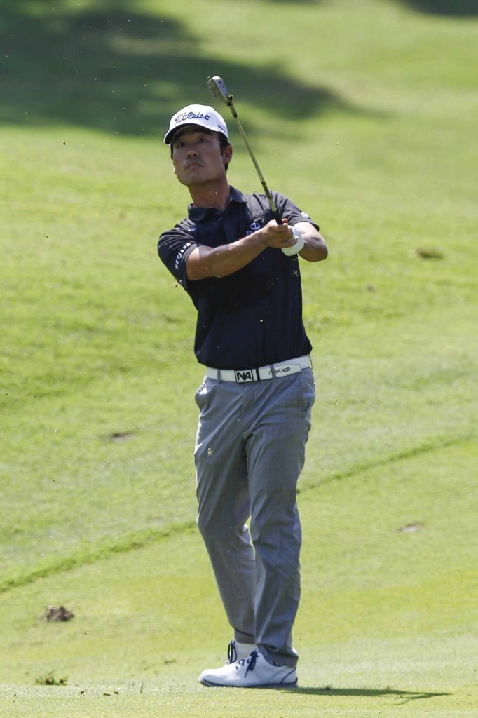 Kevin Na of the United States follows his shot on the sixteenth fairway during the first round of CIMB Classic golf tournament at Kuala Lumpur Golf and Country Club in Kuala Lumpur, Malaysia, Thursday, Oct. 29, 2015.(AP Photo/Joshua Paul)