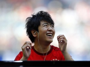 Chinese pianist Lang Lang laughs as he performs during FC Bayern Munich show. (AP Photo/Matthias Schrader)