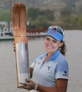 Lexi Thompson of the United States poses with the trophy after winning the LPGA KEB Hana Bank Championship golf tournament at Sky72 Golf Club in Incheon, South Korea, Sunday, Oct. 18, 2015. (AP Photo/Lee Jin-man)