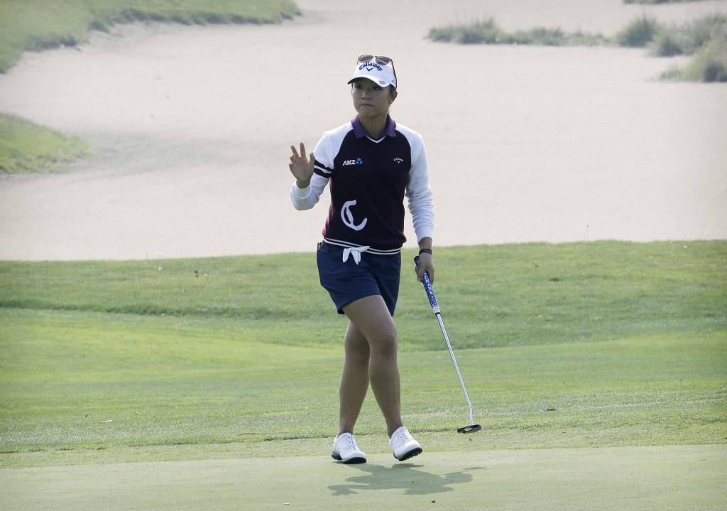 Lydia Ko of New Zealand reacts after sinking a birdie putt on the first green during the second round of the KEB Hana Bank Championship golf tournament at Sky72 Golf Club in Incheon, South Korea, Friday, Oct. 16, 2015. (AP Photo/Ahn Young-joon)