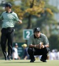 International team player Hedeki Matsuyama, right, of Japan and teammate Adam Scott of Australia prepare to putt during their foursome match at the Presidents Cup golf tournament at the Jack Nicklaus Golf Club Korea, in Incheon, South Korea, Thursday, Oct. 8, 2015.(AP Photo/Woohae Cho)