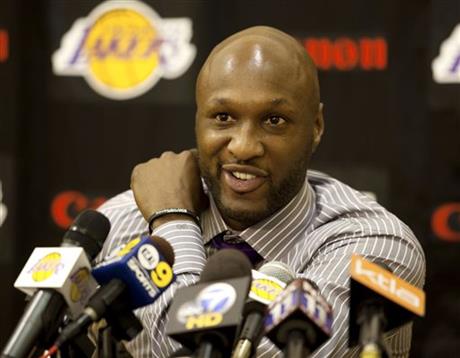 ILE - In this July 31, 2009, file photo, Los Angeles Lakers' Lamar Odom speaks to the media during a news conference after the Lakers signed Odom to a multi-year NBA basketball contract, in El Segundo, Calif. Odom spent most of his 14-year NBA career in Los Angeles with the Lakers and Clippers, becoming a fan favorite before he sought even more fame with the Kardashians. Odom, who was embraced by teammates and television fans alike for his Everyman approach to fame, was found face-down and alone Tuesday, Oct. 13, 2015, after spending four days at the Love Ranch, a legal Nevada brothel. (AP Photo/Jeff Lewis, File)