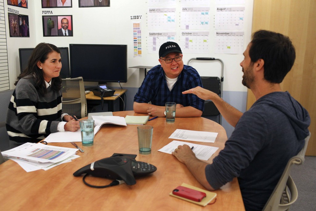 During a day in the life of (center) Director Peter Sohn and "The Good Dinosaur" with (left) Producer Denise Ream and (right) Story Supervisor Kelsey Mann on June 2, 2015 at Pixar Animation Studios in Emeryville, Calif. (Photo by Deborah Coleman/Pixar)