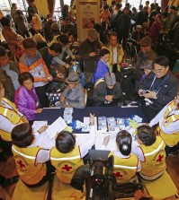 South Koreans gather to resister for the upcoming family reunions with their North Korean family members at a hotel in Sokcho, South Korea, Friday, Oct. 23, 2015. South Koreans will travel to the Diamond Mountain resort in North Korea for the Separated Family Reunion Meeting, which begins Saturday and ends Monday. (Kim Do-hun/Yonhap)