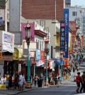 Pedestrians walk along Grant Avenue in San Francisco's Chinatown. The neighborhood is the birthplace of Chinese America, and to some extent, the broader Asian America that descended from immigration over the Pacific Ocean throughout the 19th and 20th centuries. (AP Photo/Eric Risberg)