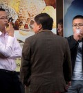 In this Thursday, Oct. 8, 2015 photo, men smoke cigarettes outside of an office building in Beijing. Research published in the medical journal The Lancet says one in three of all the young men in China are likely to die from tobacco, but that the number can fall if the men quit smoking. (AP Photo/Mark Schiefelbein)