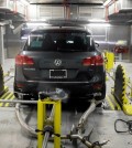 A Volkswagen Touareg diesel is tested in the Environmental Protection Agency's cold temperature test facility, Tuesday, Oct. 13, 2015, in Ann Arbor, Mich. Volkswagen has disclosed to U.S. regulators that there’s additional suspect software in its 2016 diesel models that would potentially help their exhaust systems run cleaner during government tests. (AP Photo/Carlos Osorio)