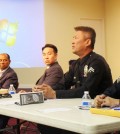 LAPD Officer Henry Choi, second from right, speaks during a seminar on elder abuse Saturday inside a Korean church.