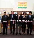 Local Korean and American community leaders, including Salinas Mayor Joe Gunter, fourth from left, and San Francisco Korean Consul General Han Dong-man, to his right, held a ribbon-cutting ceremony Sunday inside John Steinbeck Library to celebrate the opening of the Korean collection.