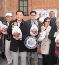 New York Assemblyman Ron Kim, fourth from left, Korean associations and churches delivered 300 turkeys to volunteer groups Tuesday for Thanksgiving.