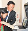 Virginia House Delegate Mark Keam votes Tuesday with his daughter.