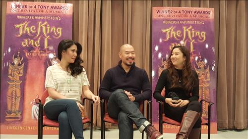 Hoon Lee, center, sits with co-stars Ashley Park, right, and Ruthie Ann Miles.