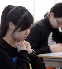 Students take the CSAT at a high school in Seoul, November 2014. (Korea Times file)