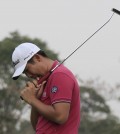 An Byeong-Hun of South Korea reacts on the 18th hole after missing a putt during the final round of the BMW Masters golf tournament at the Lake Malaren Golf Club in Shanghai, China Sunday, Nov. 15, 2015. (AP Photo)
