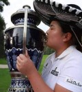 Inbee Park kisses the championship trophy after winning the Lorena Ochoa Invitational in Mexico. (AP)