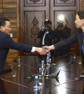 Kim Ki-woong (R), South Korea's chief delegate for working-level inter-Korean talks, shakes hands with his North Korean counterpart Hwang Chol at the truce village of Panmunjom on Nov. 26, 2015, at the start of the meeting to prepare for high-level government talks. (Photo provided by the Unification Ministry) (Yonhap)