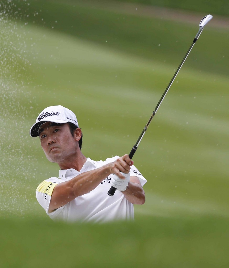 Kevin Na of the United States plays out of a bunker (AP Photo/Joshua Paul)