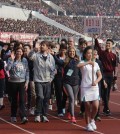 Foreign runners join a ceremony to mark the annual Pyongyang Marathon in this photo taken in August 2014. North Korea plans to invite up to 1,500 marathoners from abroad in April next year. 
(Courtesy of Koryo Tours)