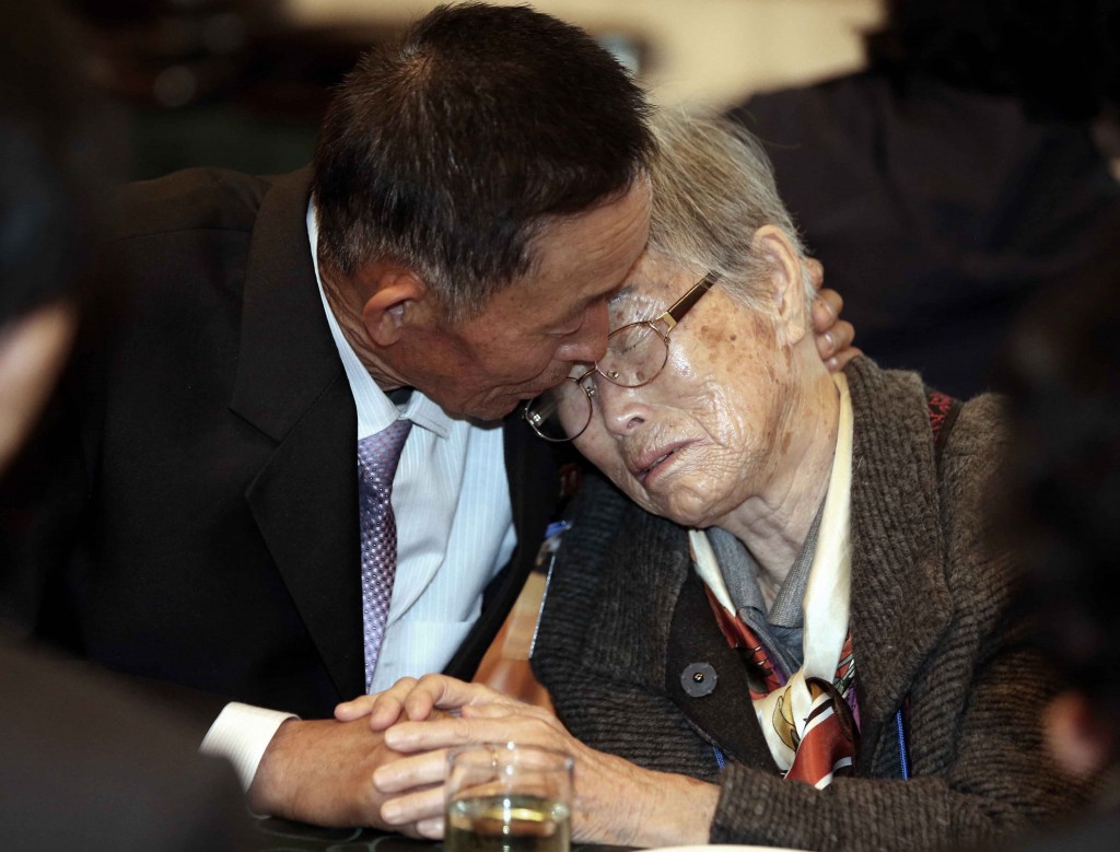 North Korean Han Son-il, left, hugs with his South Korean mother Lee Kum-seok to bid farewell after the Separated Family Reunion Meeting at Diamond Mountain resort in North Korea, Monday, Oct. 26, 2015. Parents and children, brothers and sisters and other relatives separated by the Korean war wept and hugged each other as they parted after their brief reunions, most for the first time in more than six decades. (Kim Do-hoon/Yonhap)