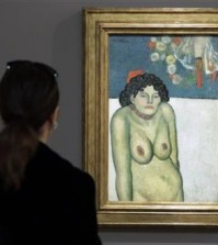 FILE - This Oct. 30, 2015 file photo shows "The Nightclub Singer,” a 1901 painting by Picasso from his Blue Period, at Sotheby's in New York. The work features a second picture on the reverse side depicting Picasso’s art dealer, Pere Manach. The piece is estimated to fetch $60 million on Thursday night, Nov. 5, 2015 at Sotheby’s fall art auction. (AP Photo/Richard Drew, File)