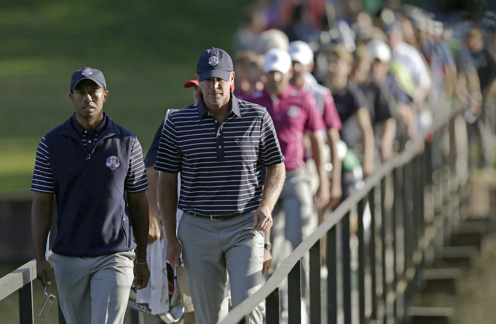 USA's Tiger Woods and Steve Stricker during the 2012 Ryder Cup at the Medinah Country Club in Medinah, Ill. (AP Photo/David J. Phillip)