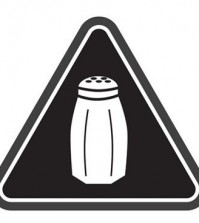 File-In this undated image released by the New York City Health Department, shows a graphic that will soon be warning NYC consumers of high salt content. New York City is opening a new era in nutritional warnings this week: Chain restaurants will have to start putting a special symbol on highly salty dishes. The first-of-its-kind rule takes effect Tuesday. It will require a salt-shaker-like emblem on some sandwiches, salads and other menu items that top the recommended daily limit of 2,300 milligrams of sodium. That’s about a teaspoon. (Antonio D'Angelo/New York City Health Department via AP)