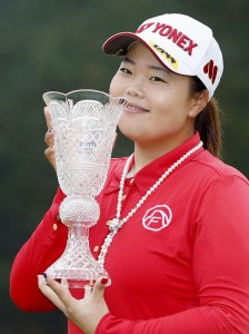 Sun-ju Ahn of South Korea smiles with a trophy after winning the Toto Japan Classic, her first LPGA Tour victory, in Shima, central Japan. Ahn won the 20th Japan LPGA title, beating fellow South Korean player Ji-Hee Lee and American Angela Stanford with a birdie on the first hole of a playoff. (Naoya Osato/Kyodo News via AP) 