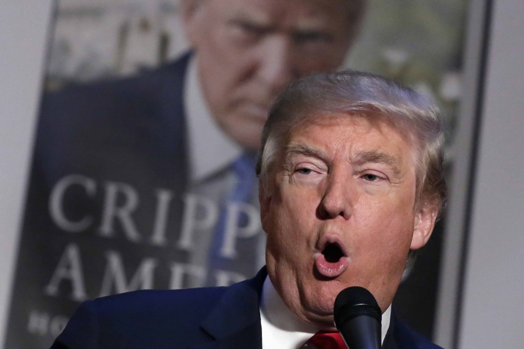 Republican presidential candidate Donald Trump speaks about his new book, entitled "Crippled America," at Trump Tower, in New York, Tuesday, Nov. 3, 2015. The book speaks directly to voters, making the case that Trump has the experience and business savvy to accomplish things that traditional, all-talk, no-action politicians can't.(AP Photo/Richard Drew)
