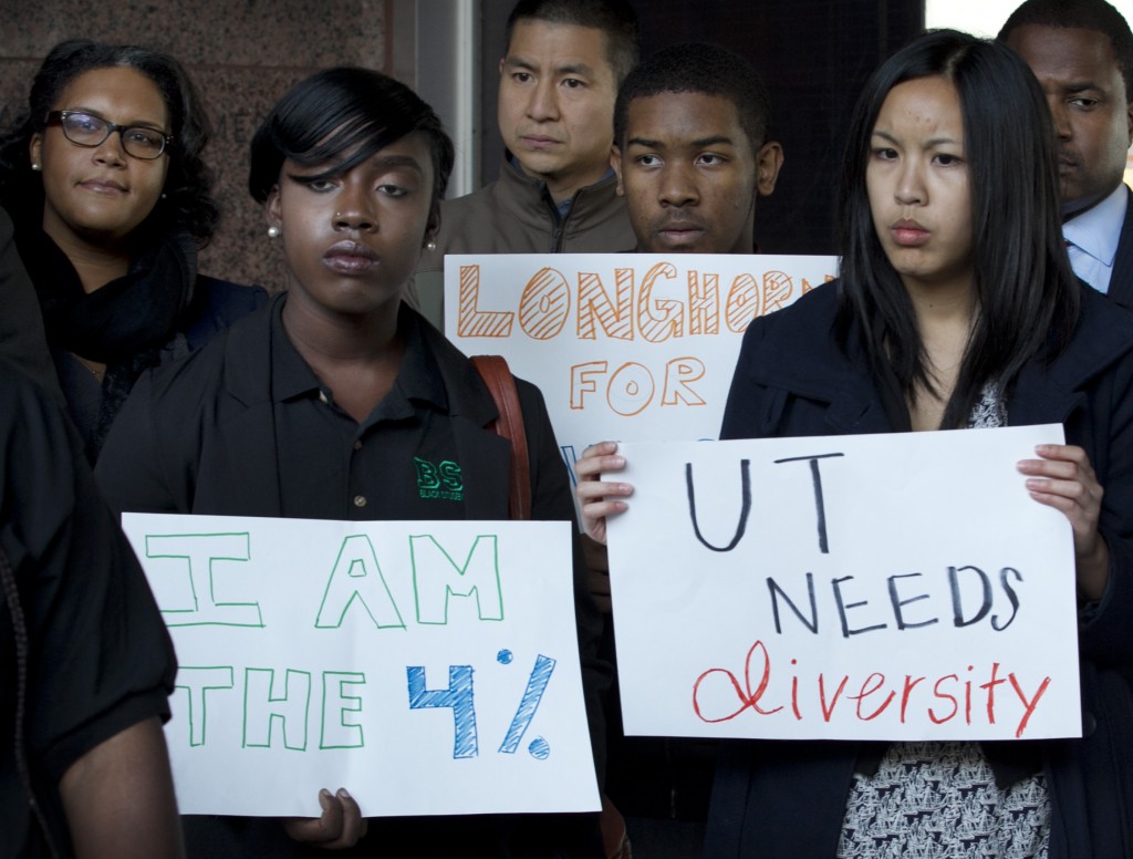 Supporters of the University of Texas in its case against Abigail Fisher demonstrate at the Homer Thornberry Judicial Building in Austin, Texas. The 5th Circuit Court of Appeals is rehearing the case of Abigail Fisher, a white woman who in 2008 was not admitted to the University of Texas at Austin because she did not graduate in the top 10 percent of her high school class _ the criterion for 75 percent of the school's admissions. (AP Photo/Austin American-Statesman, Jay Janner)