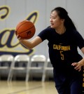 In this Dec. 12, 2015 photo, California's Chen Yue rebounds during a team workout in Berkeley, Calif. The 6-foot-7 freshman center, who is believed to be one of the first Chinese basketball players to play at a high college level, says she came to the U.S. to challenge herself both on the court and in the classroom. (AP Photo/Ben Margot)