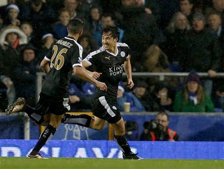 Leicester City's Shanji Okazaki of Japan, right, celebrates after scoring a goal during the English Premier League soccer match at Goodison Park, Liverpool, England, Saturday Dec.19, 2015. (Peter Byrnev / PA via AP)