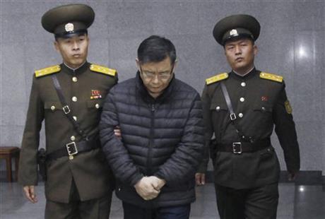 Hyeon Soo Lim, center, who pastors the Light Korean Presbyterian Church in Toronto, is escorted to his sentencing in Pyongyang, North Korea, Wednesday, Dec. 16, 2015. North Korea's Supreme Court sentenced a Canadian pastor to life in prison with hard labor on Wednesday for what it called crimes against the state. (AP Photo/Jon Chol Jin) 