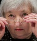 In this Feb. 25, 2015, file photo, Federal Reserve Chair Janet Yellen removes her glasses as she testifies on Capitol Hill in Washington. The Federal Reserve is widely expected to raise its key rate from record lows, on Wednesday, Dec. 16, 2015, potentially heralding higher lending rates in an economy much sturdier than the one the Fed helped rescue in 2008 with borrowing rates near zero. (AP Photo/Pablo Martinez Monsivais, File)