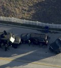 Police armored cars close in on a suspect vehicle following a shooting incident in San Bernardino, California in this still image taken from video December 2, 2015. Gunmen opened fire on a holiday party on Wednesday at a social services agency in San Bernardino, killing 14 people and wounding 17 others before fleeing, authorities said. (Reuters/NBCLA.com via Yonhap)