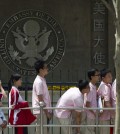 FILE -- In this May 2012 file photo, Chinese students wait outside the U.S. Embassy for their visa application interviews in Beijing, China.  The number of international students studying at U.S. colleges increased by 10 percent last year, marking the largest single-year gain in 35 years, according to new federal data. (AP Photo/Alexander F. Yuan, File)