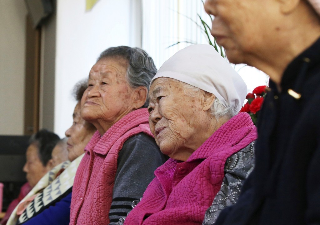 Former South Korean sex slaves, who were forced to serve for the Japanese Army during World War II, wait for results of a meeting of South Korean and Japanese foreign ministers at the Nanumui Jip, The House of Sharing, in Gwangju, South Korea, Monday, Dec. 28, 2015. The foreign ministers said Monday they had reached a deal meant to resolve a decades-long impasse over Korean women forced into Japanese military-run brothels during World War II, a potentially dramatic breakthrough between the Northeast Asian neighbors and rivals. (Hong Ji-won/Yonhap via AP) 