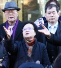 Bereaved families of Korean citizens forced into labor during the Japanese occupation of the Korean Peninsula (1910-45) express their disappointment with a decision made by the Constitutional Court in front of the courthouse in central Seoul, Wednesday. The court rejected a petition to review the constitutionality of the 1965 agreement between Japan and Korea regarding compensation for Koreans forced into wartime labor. (Yonhap)