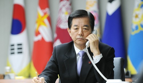South Korean Defense Minister Han Min-koo talks with his Chinese counterpart, Chang Wanquan, on the newly established hotline at the defense ministry in Seoul on Dec. 31, 2015, in this photo released by the South Korean ministry. The hotline was set up between them on the same day. The two countries launched the hotline to facilitate their cooperation on security issues in the Korean Peninsula and in the region. (Yonhap