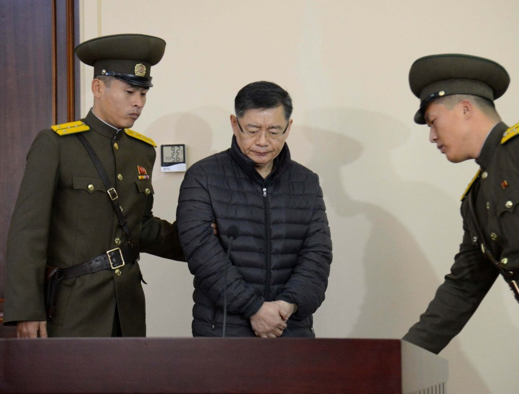 Hyeon Soo Lim, center, who pastors the Light Korean Presbyterian Church in Toronto, is escorted to his sentencing in Pyongyang, North Korea, Wednesday, Dec. 16, 2015. North Korea's Supreme Court sentenced a Canadian pastor to life in prison with hard labor on Wednesday for what it called crimes against the state.  
