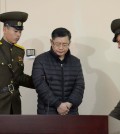 Hyeon Soo Lim, center, who pastors the Light Korean Presbyterian Church in Toronto, is escorted to his sentencing in Pyongyang, North Korea, Wednesday, Dec. 16, 2015. North Korea's Supreme Court sentenced a Canadian pastor to life in prison with hard labor on Wednesday for what it called crimes against the state.