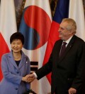 Czech Republic's President Milos Zeman, right, welcomes his South Korean counterpart Park Geun-hye, left, at the Prague castle during her working visit in Prague, Czech Republic, Wednesday, Dec. 2, 2015. (AP Photo/Petr David Josek)