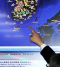A Korea Meteorological Administration researcher examines a map showing the earthquake that hit southwest Korea early Tuesday. The 3.9 magnitude was the strongest on the peninsula this year. (Yonhap)