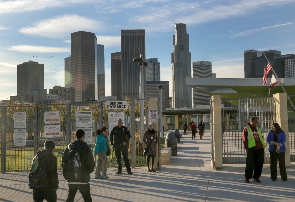 Los Angeles-area students head back to school at the Edward R. Roybal Learning Center in Los Angeles Wednesday, Dec. 16, 2015. Students are heading back to class a day after an emailed threat triggered a shutdown of the vast Los Angeles Unified School District. (AP Photo/Damian Dovarganes)