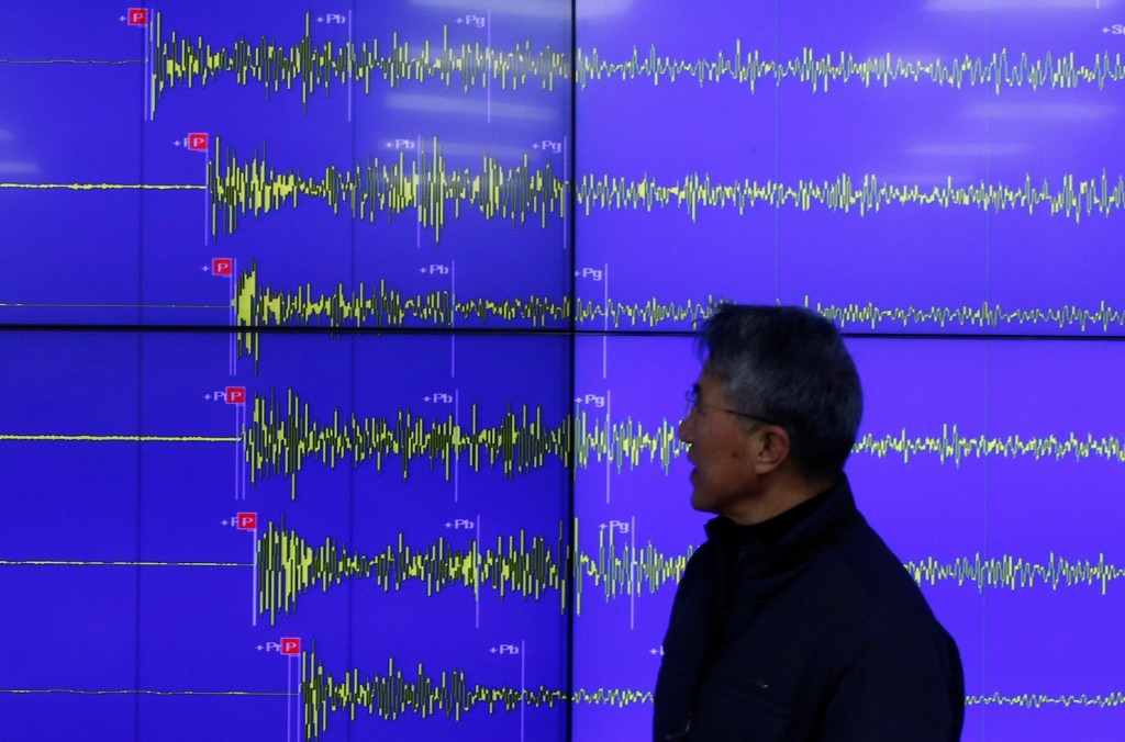 Earthquake and Volcano of the Korea Meteorological Administration Director General Yun Won-tae stands in front of a screen showing seismic waves that were measured in South Korea, in Seoul Wednesday, Jan. 6, 2016. North Korea said it conducted a powerful hydrogen bomb test Wednesday, a defiant and surprising move that, if confirmed, would be a huge jump in Pyongyang's quest to improve its still-limited nuclear arsenal. (AP Photo/Lee Jin-man)