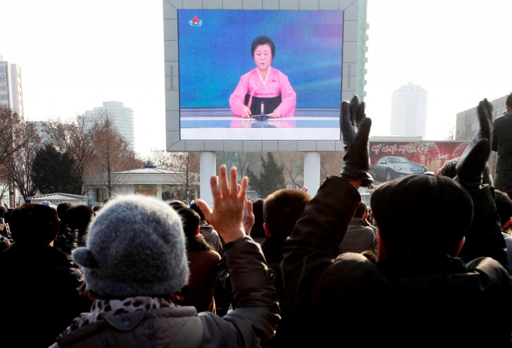 North Koreans watch a news broadcast on a video screen outside Pyongyang Railway Station in Pyongyang, North Korea, Wednesday, Jan. 6, 2016. Pyongyang has long claimed it has the right to develop nuclear weapons to defend itself against the U.S., an established nuclear power with whom it has been in a state of war for more than 65 years. But to build a credible nuclear threat, the North must explode new nuclear devices — including miniaturized ones — so its scientists can improve their designs and technology. (AP Photo/Kim Kwang Hyon)