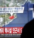 People walk by a screen showing the news reporting about an earthquake near North Korea's nuclear facility, in Seoul, South Korea, Wednesday, Jan. 6, 2016. South Korean officials detected an "artificial earthquake" near North Korea's main nuclear test site Wednesday, a strong indication that nuclear-armed Pyongyang had conducted its fourth atomic test. North Korea said it planned an "important announcement" later Wednesday. The letter read "5.1 Earthquake near North Korea's nuclear facility." (AP Photo/Lee Jin-man)