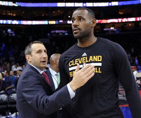 FILE - In this Nov. 2, 2015, file photo, Cleveland Cavaliers coach David Blatt pats LeBron James on the chest at the end of an NBA basketball game against the Philadelphia 76ers in Philadelphia. James’ calculating image wasn’t helped when the Cavaliers stunningly fired Blatt on Friday, Jan. 22, despite Blatt leading the team to the NBA Finals last season and an Eastern Conference-best 30-11 record this season. James has played for three coaches during his two stints in Cleveland, (AP Photo/Michael Perez, File)