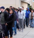 Customers wait in line at the Blue Bird Liquor Store to buy Powerball lottery tickets in Hawthorne, Calif. on Saturday, Jan. 9, 2016. Ticket sales for the multi-state Powerball lottery soared Saturday, in the largest jackpot in U.S. history which grew to $900 million just hours before Saturday night's drawing. (AP Photo/Richard Vogel)